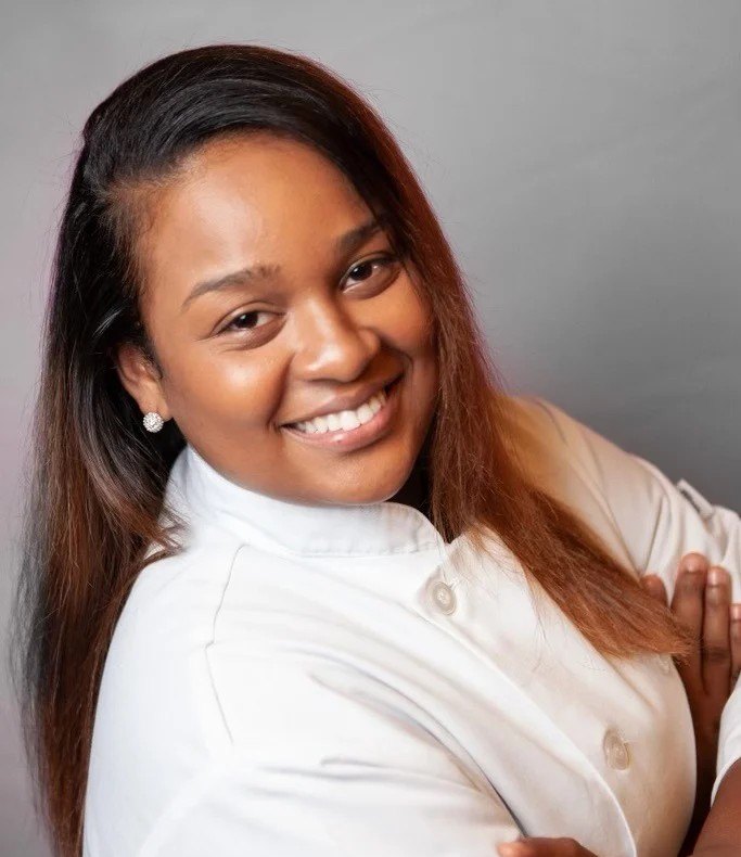 Executive Chef Za'Mecca Fentress in her chef's coat