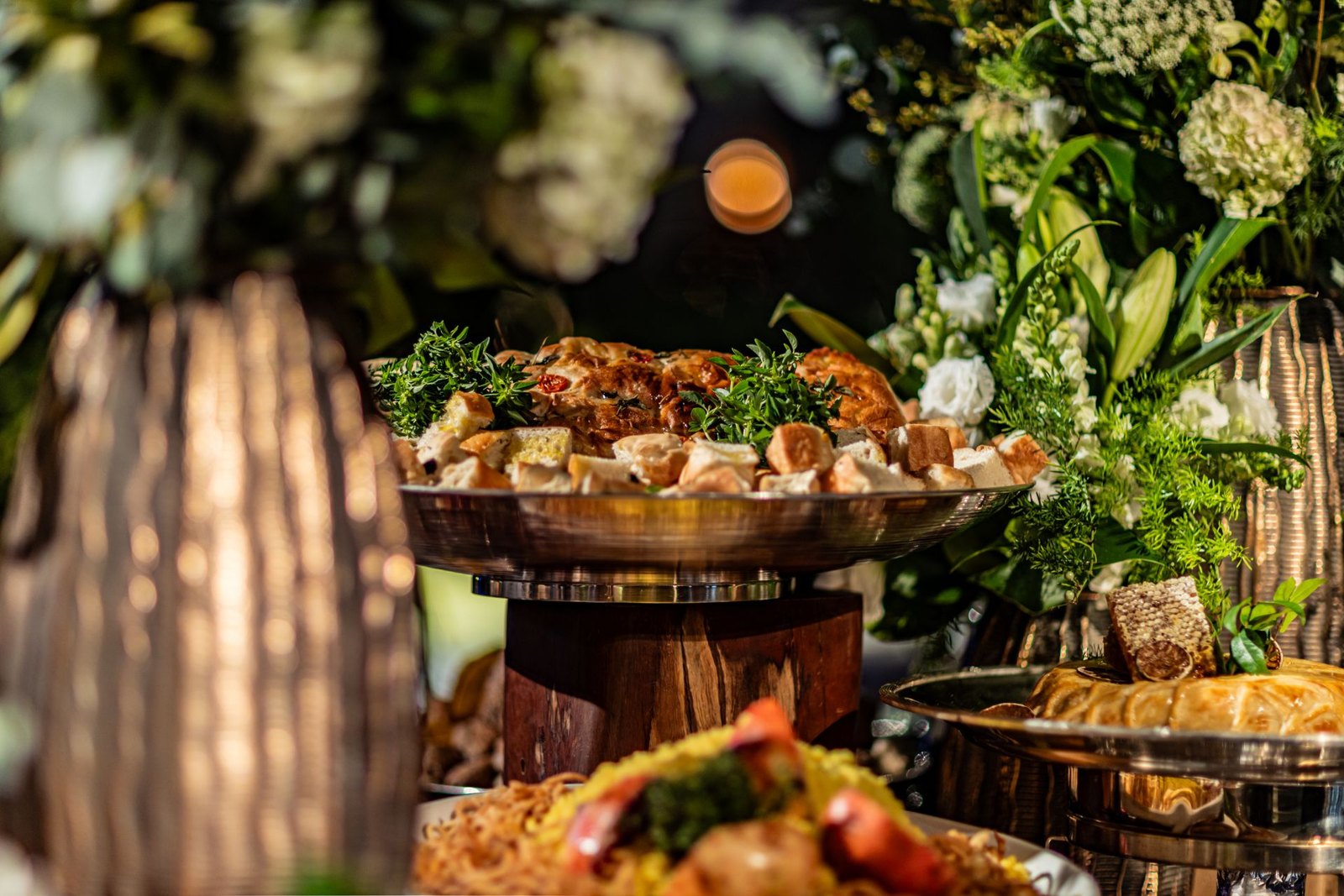 Luxury grazing table styled with candlelight and roses